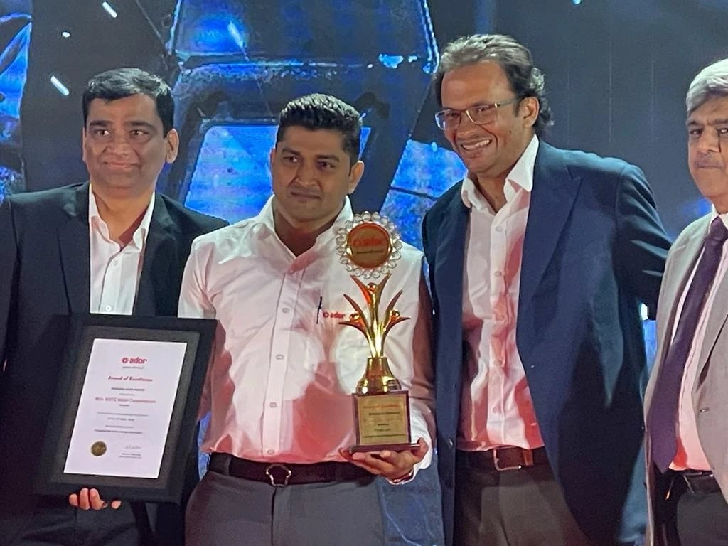 The SOTC Weld Corporation team receiving the Ador Award of Excellence on stage